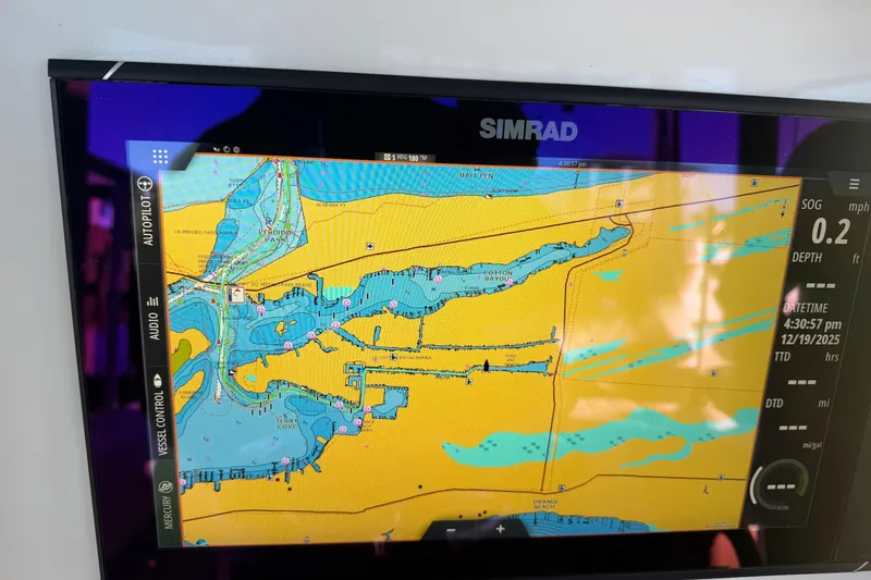 Slide: The Image of Storage compartment on a 2013 Freeman 33 boat, featuring a latch and open lid. - 57