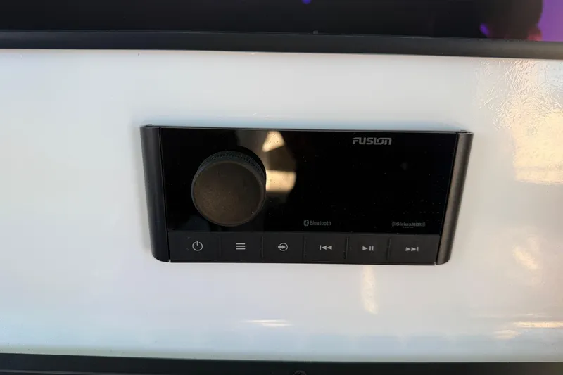 Slide: The Image of Simrad display on Freeman 33 boat, showing engine hours and "No source" message. - 58