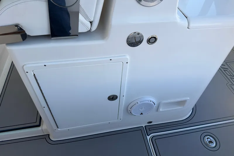Slide: The Image of Interior view of a 2013 Freeman 33 boat, showcasing metal fixtures and a speaker. - 64