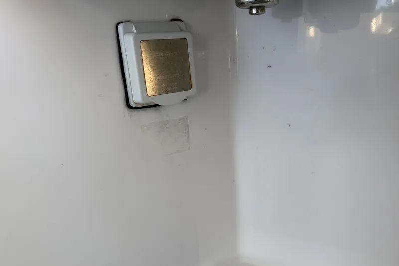 Slide: The Image of Simrad marine radio display on Freeman 33, 2013 model, showing channel 69. - 65