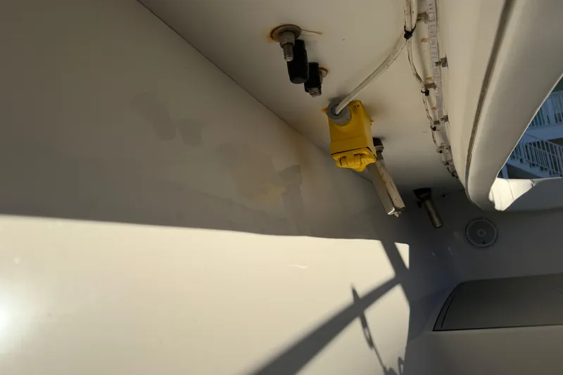 Slide: The Image of Luxurious seating on a 2013 Freeman 33 boat, featuring quilted upholstery and armrests. - 66