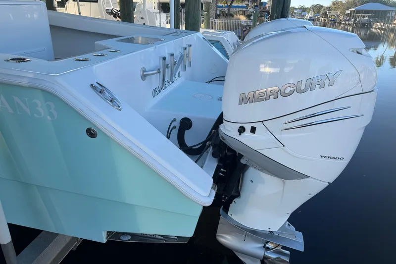 Slide: The Image of 2013 Freeman 33 boat in dock, featuring Minn Kota equipment. - 7