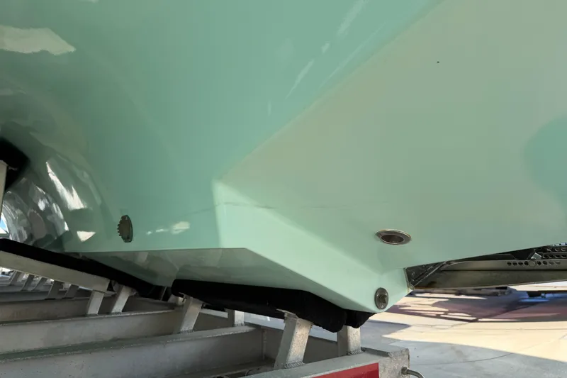 Slide: The Image of Close-up of a 2013 Freeman 33 boat hull on a trailer. - 91