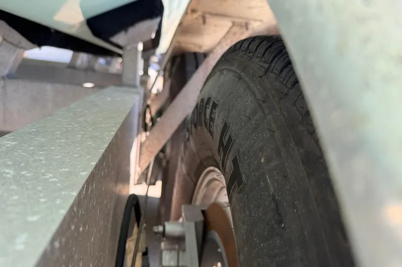 Slide: The Image of Close-up of a Freeman 33 trailer tire, showcasing tread details, 2013 model. - 96
