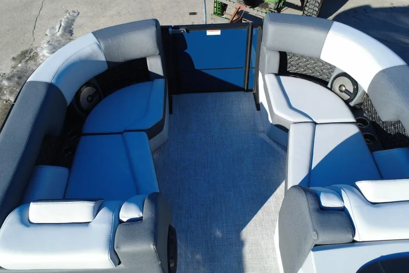 Slide: The Image of Alera M23Q 2026 boat interior with blue and gray seating arrangement. - 10