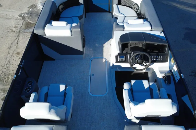 Slide: The Image of Alera M23Q 2026 boat interior with modern seating and steering console. - 11