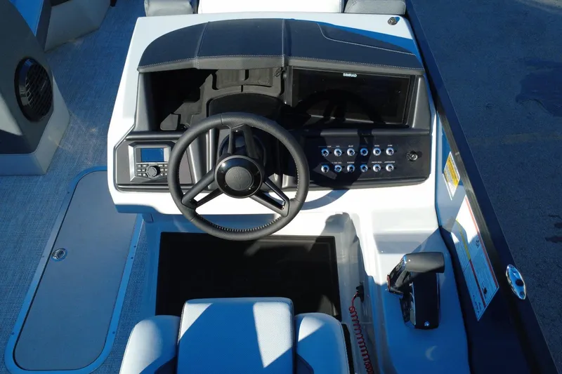 Slide: The Image of 2026 Alera M23Q boat dashboard with steering wheel and control panel. - 13