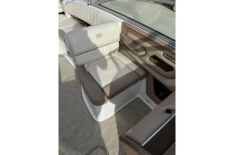 Slide: The Image of 2010 Cobalt 276 boat interior with beige and brown seating. - 15