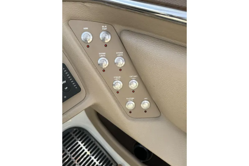 Slide: The Image of Control panel of a 2010 Cobalt 276 boat with various switches. - 19