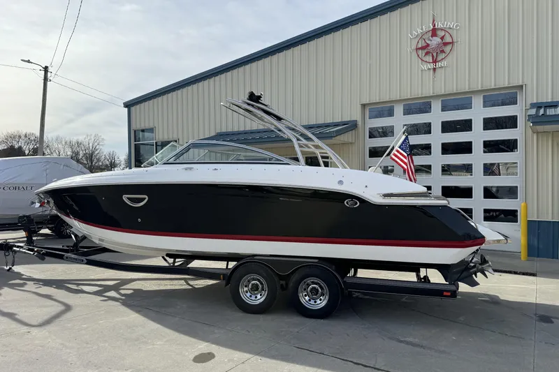 Slide: The Image of 2010 Cobalt 276 boat on trailer outside Lake Viking Marine building. - 2