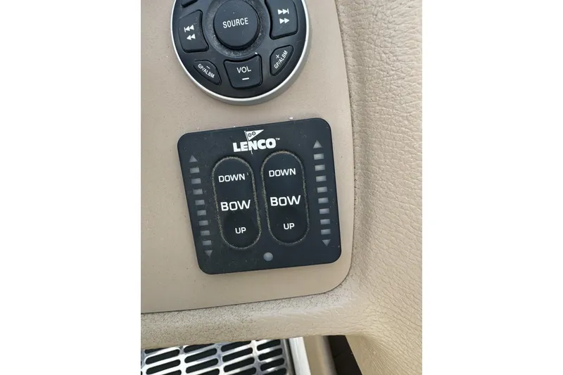 Slide: The Image of Lenco trim tab controls on 2010 Cobalt 276 boat dashboard. - 20