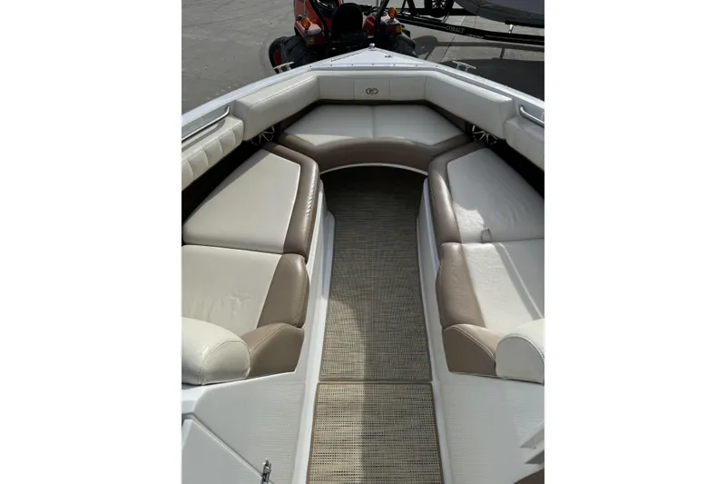 Slide: The Image of Interior of 2010 Cobalt 276 boat with beige and white seating. - 24