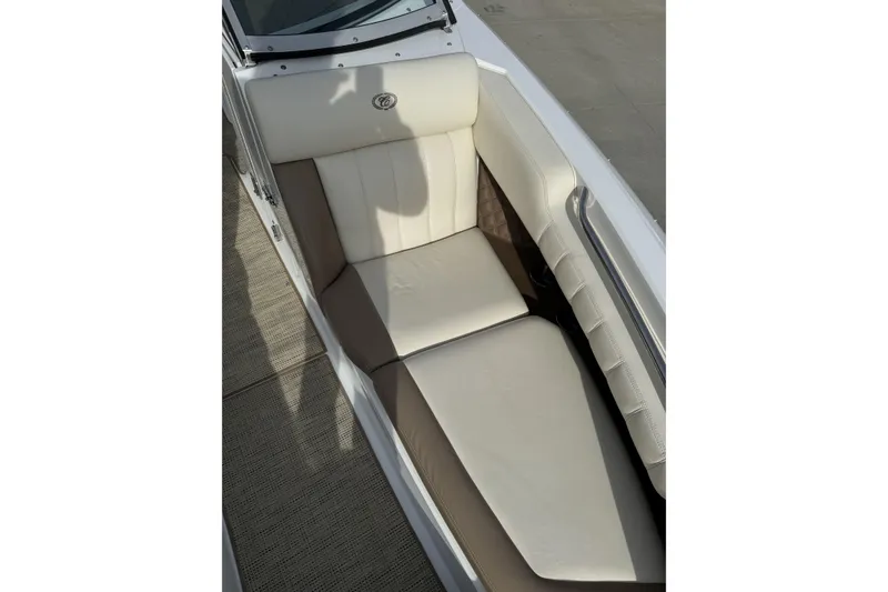 Slide: The Image of 2010 Cobalt 276 boat interior with beige seating and sleek design. - 26
