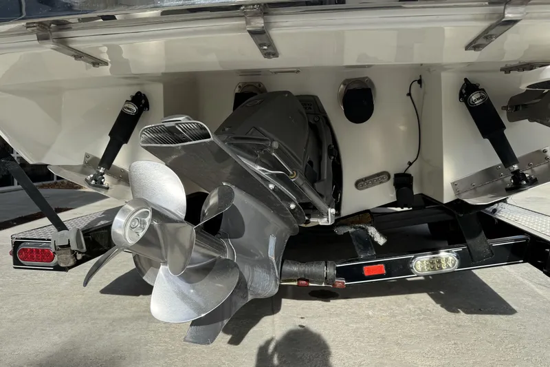 Slide: The Image of 2010 Cobalt 276 boat stern with dual propellers and trailer. - 4