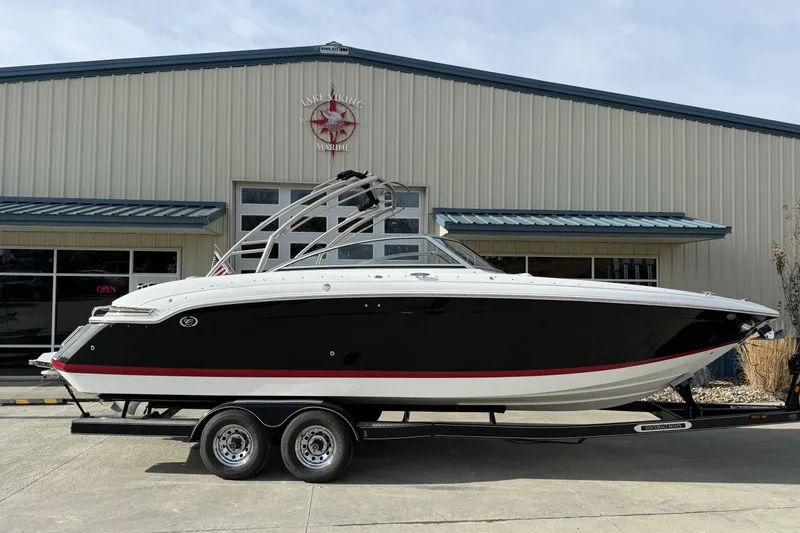 Slide: The Image of 2010 Cobalt 276 boat on trailer outside Lake Viking Marine building. - 5