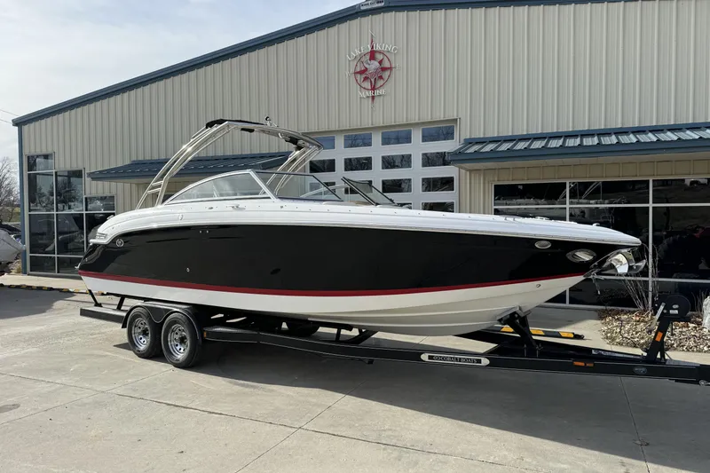 Slide: The Image of 2010 Cobalt 276 boat on trailer outside a marine dealership. - 6