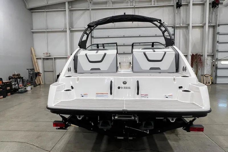 Slide: The Image of 2025 Yamaha Boats AR220 in a showroom, showcasing sleek design and modern features. - 3