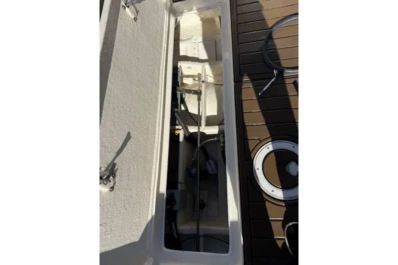 Slide: The Image of Open hatch on 1997 Tiara Yachts 2900 Open, revealing interior components and deck details. - 15