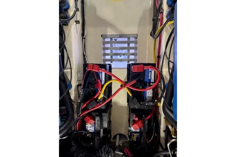 Slide: The Image of Battery compartment of a 1997 Tiara Yachts 2900 Open with wiring connections. - 18