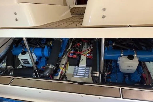 Slide: The Image of Engine compartment of a 1997 Tiara Yachts 2900 Open, showcasing dual engines and wiring. - 21