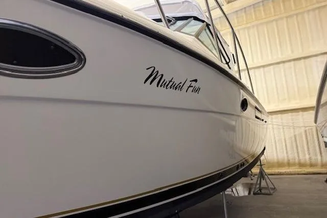 Slide: The Image of 1997 Tiara Yachts 2900 Open boat named "Mutual Fun" in storage. - 7