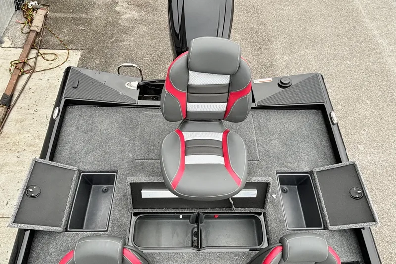 Slide: The Image of 2024 Ranger RT188 boat interior with gray and red seating, storage compartments, and carpeted flooring. - 10
