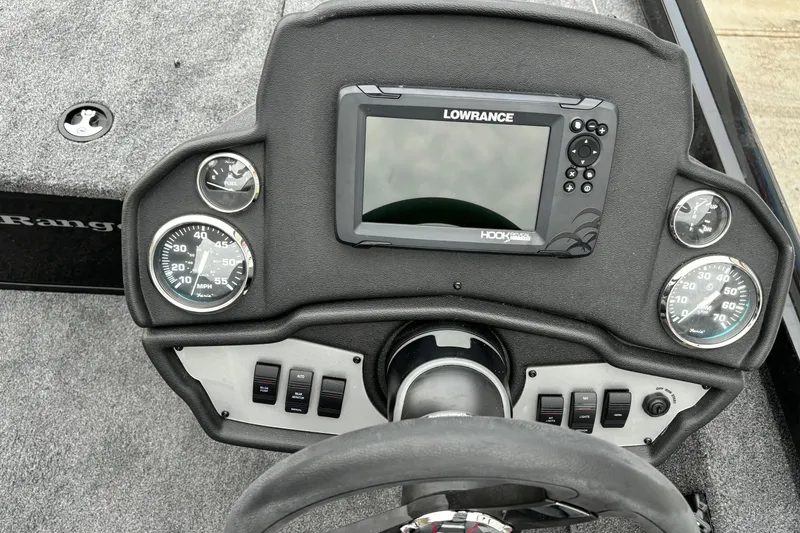 Slide: The Image of 2024 Ranger RT188 boat dashboard with Lowrance fishfinder and gauges. - 8