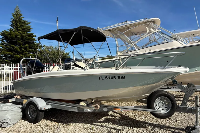The Image of 2014 Boston Whaler 170 Super Sport boat on trailer, outdoor display. - 0