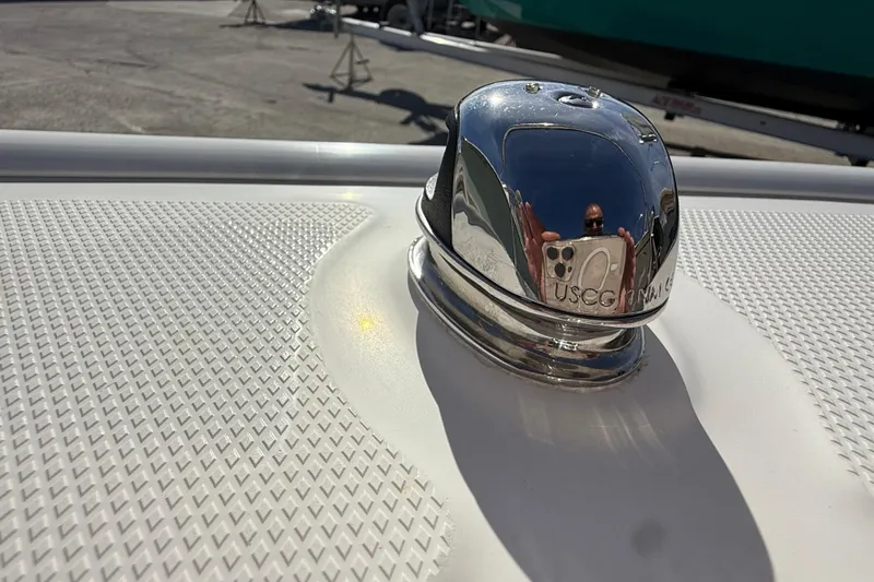 Slide: The Image of 2018 Boston Whaler 170 Super Sport boat with 90 HP engine in a sunny marina. - 12