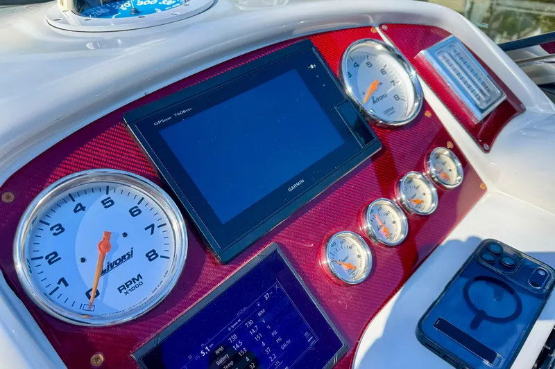 Slide: The Image of Dashboard of a 2006 Formula 382 FASTech boat with gauges and Garmin display. - 10