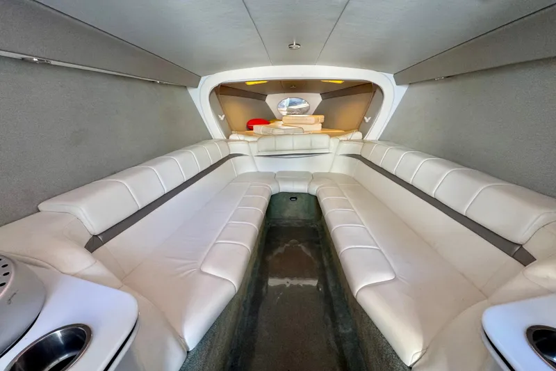 Slide: The Image of Interior of a 2006 Formula 382 FASTech boat with white leather seating. - 11