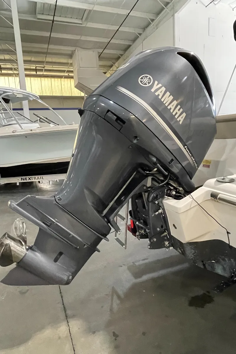 Slide: The Image of 2022 Key West 239 DFS boat logo on white hull. - 15