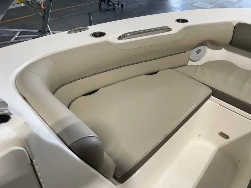Slide: The Image of 2022 Key West 239 DFS boat interior with beige seating and spacious layout. - 20