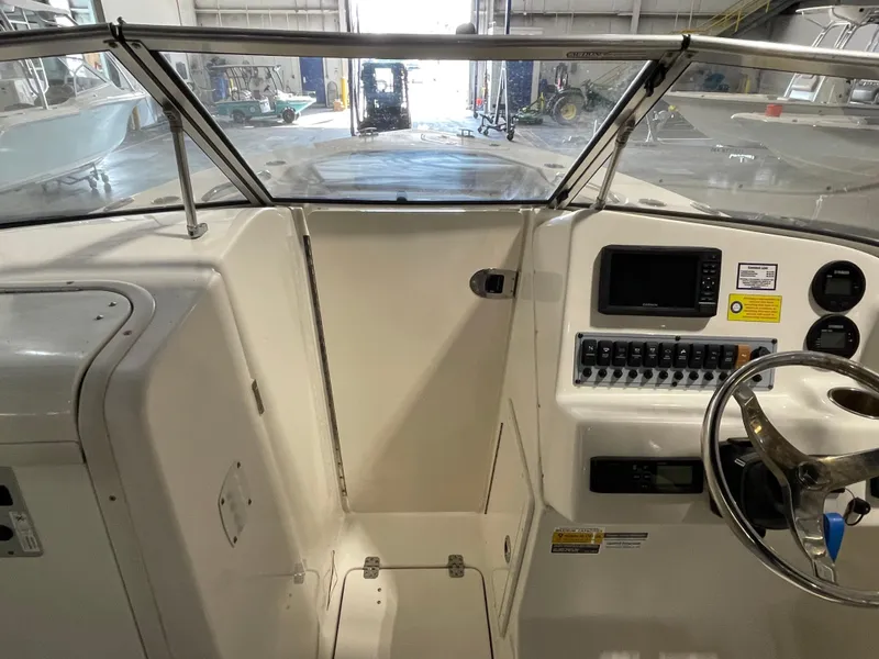 Slide: The Image of 2022 Key West 239 DFS boat seat, featuring sleek gray upholstery and ergonomic design. - 21