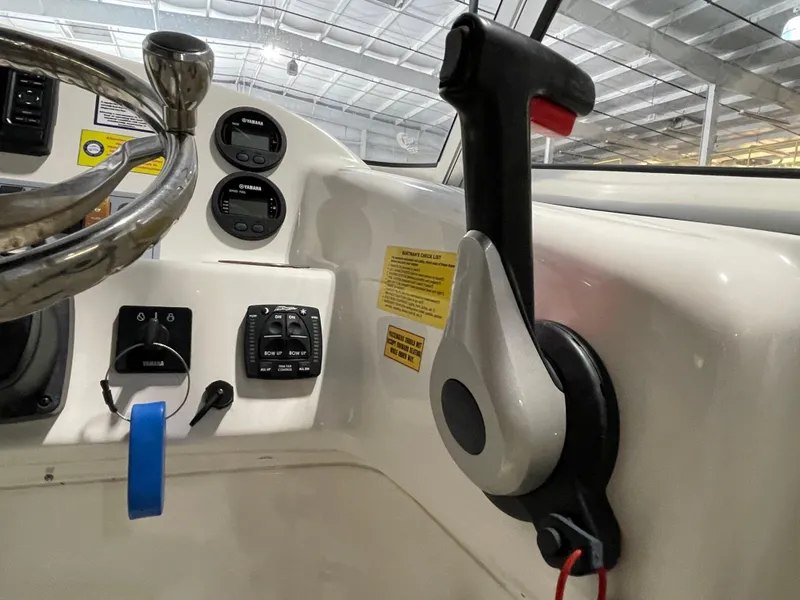 Slide: The Image of 2022 Key West 239 DFS boat interior with seating and storage area. - 25