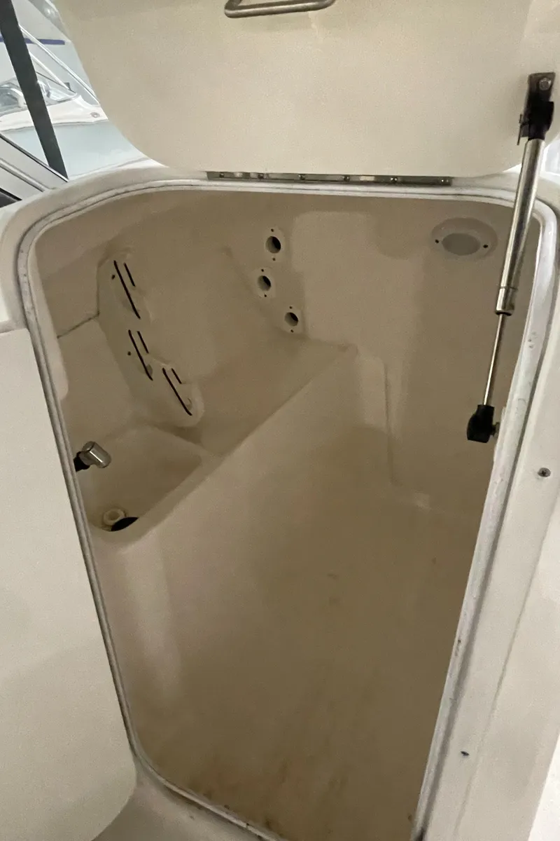 Slide: The Image of 2022 Key West 239 DFS boat seating, featuring comfortable gray upholstery. - 29