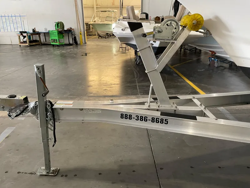 Slide: The Image of Trailer hitch of 2022 Key West 239 DFS boat in parking lot. - 36