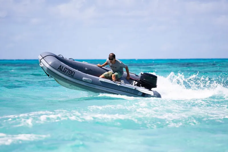 The Image of Man driving 2026 Highfield Classic 340 inflatable boat on turquoise water. - 0