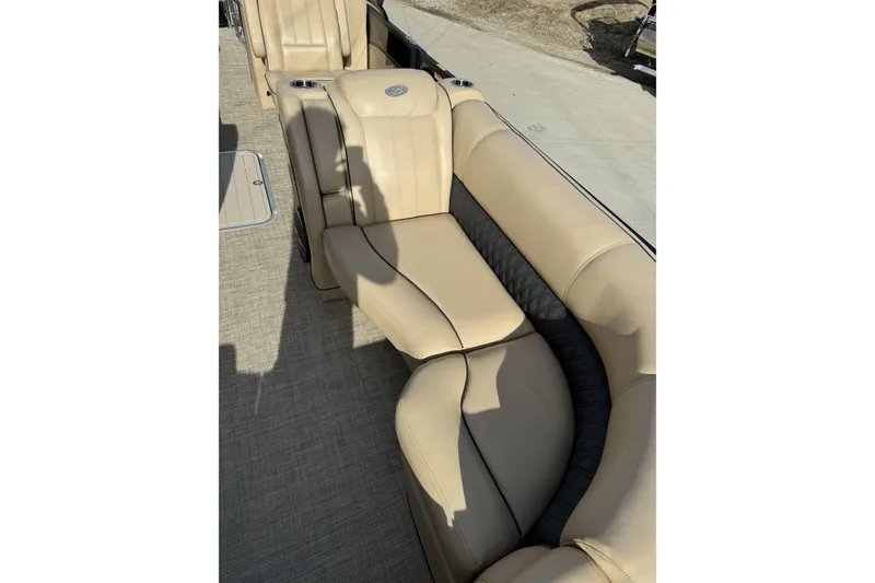 Slide: The Image of 2019 Barletta L23QC SS boat with beige leather seating and cup holders. - 11