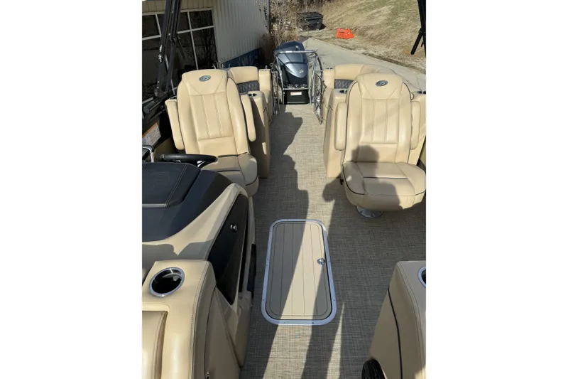 Slide: The Image of 2019 Barletta L23QC SS pontoon boat interior with beige seating and modern design. - 12