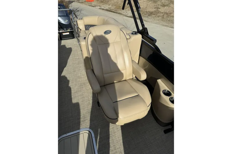 Slide: The Image of 2019 Barletta L23QC SS boat with beige captain's chair and cup holders. - 13