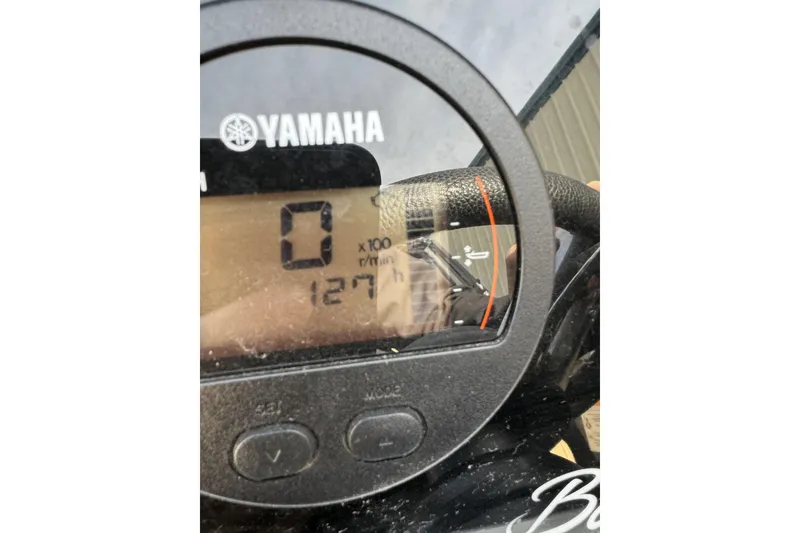 Slide: The Image of Close-up of Yamaha gauge on 2019 Barletta L23QC SS, displaying 127 hours. - 19
