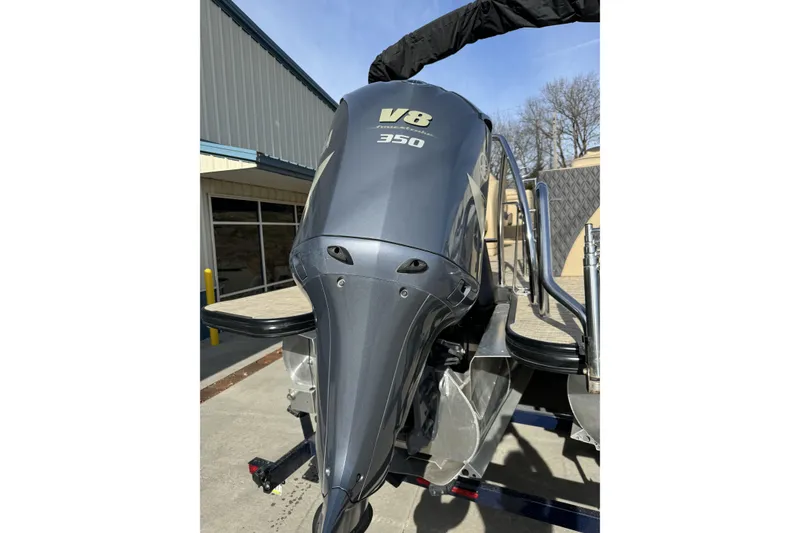 Slide: The Image of 2019 Barletta L23QC SS with V8 350 engine, parked outdoors. - 3