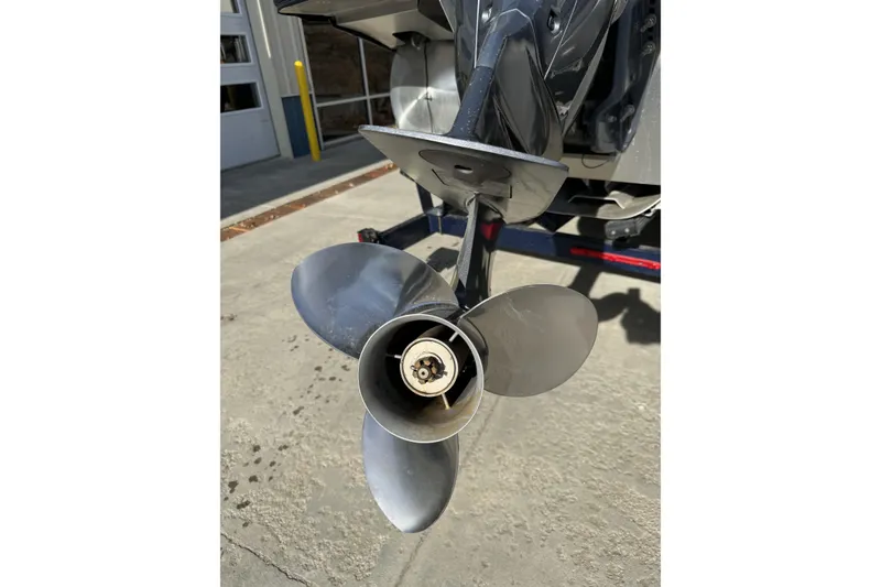 Slide: The Image of 2019 Barletta L23QC SS boat propeller in a parking area. - 4