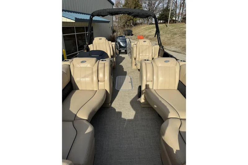 Slide: The Image of 2019 Barletta L23QC SS pontoon boat with beige seating and spacious interior. - 9