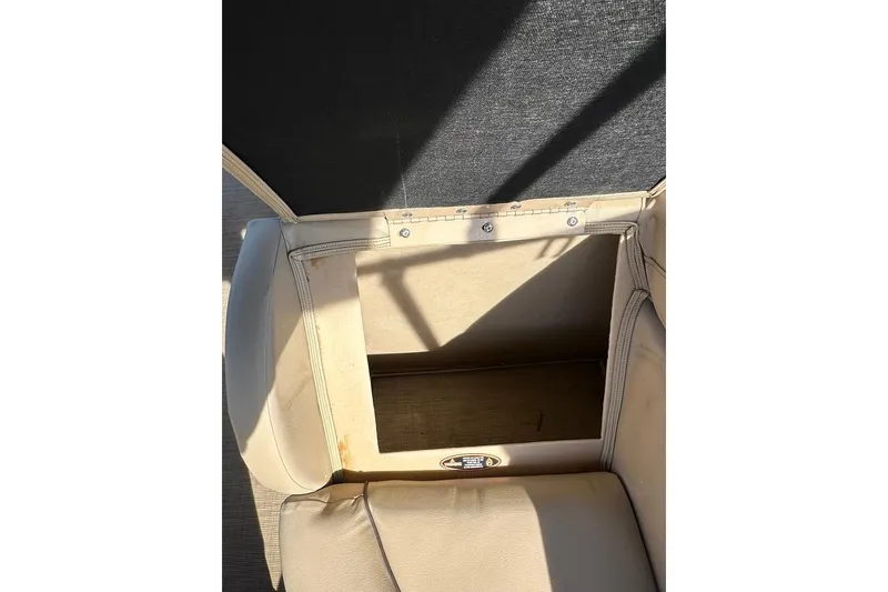 Slide: The Image of Open storage compartment in 2017 Harris Cruiser 220 boat seat. - 40