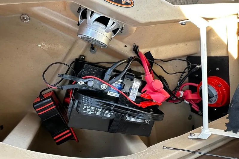 Slide: The Image of Battery compartment of a 2017 Harris Cruiser 220 boat with wiring and components. - 41