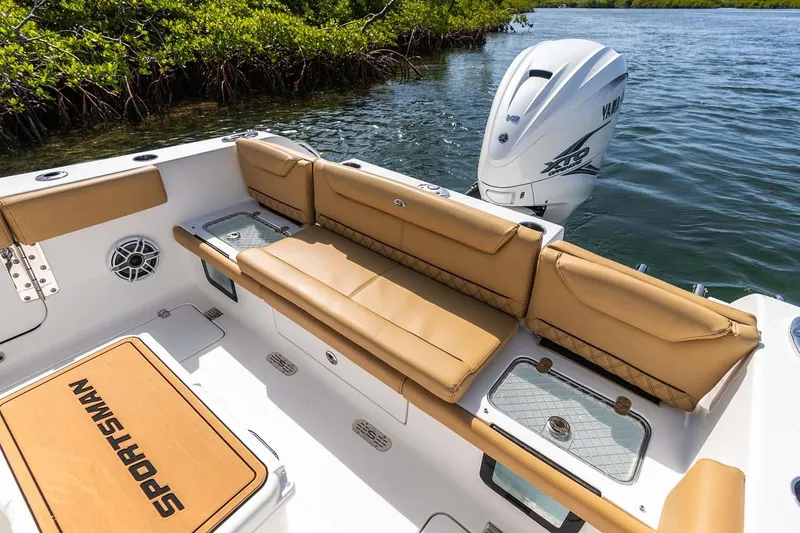 Slide: The Image of Manufacturer Provided Image: 2025 Sportsman Heritage 261 Center Console boat with tan seating and Yamaha outboard motor. - 18