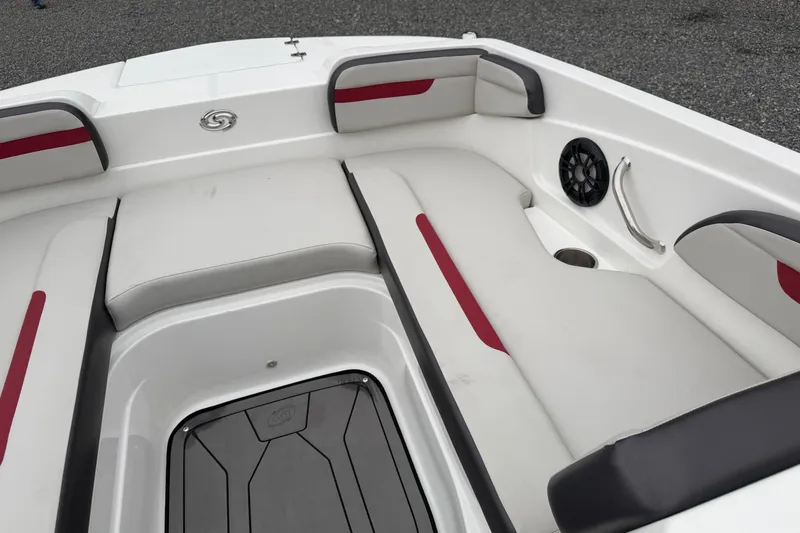 Slide: The Image of 2023 Hurricane SunDeck Sport 205 OB boat interior with cushioned seating and speaker. - 11