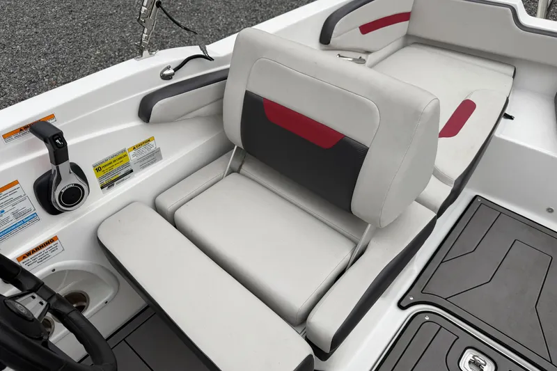 Slide: The Image of 2023 Hurricane SunDeck Sport 205 OB boat interior with cushioned seating and control panel. - 14